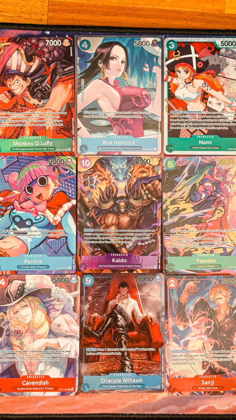 A binder page of One Piece trading cards
