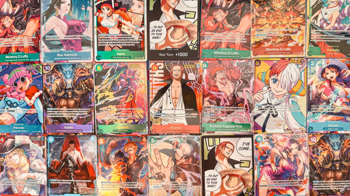 A wall of One Piece trading cards from the Shuffle Up collection